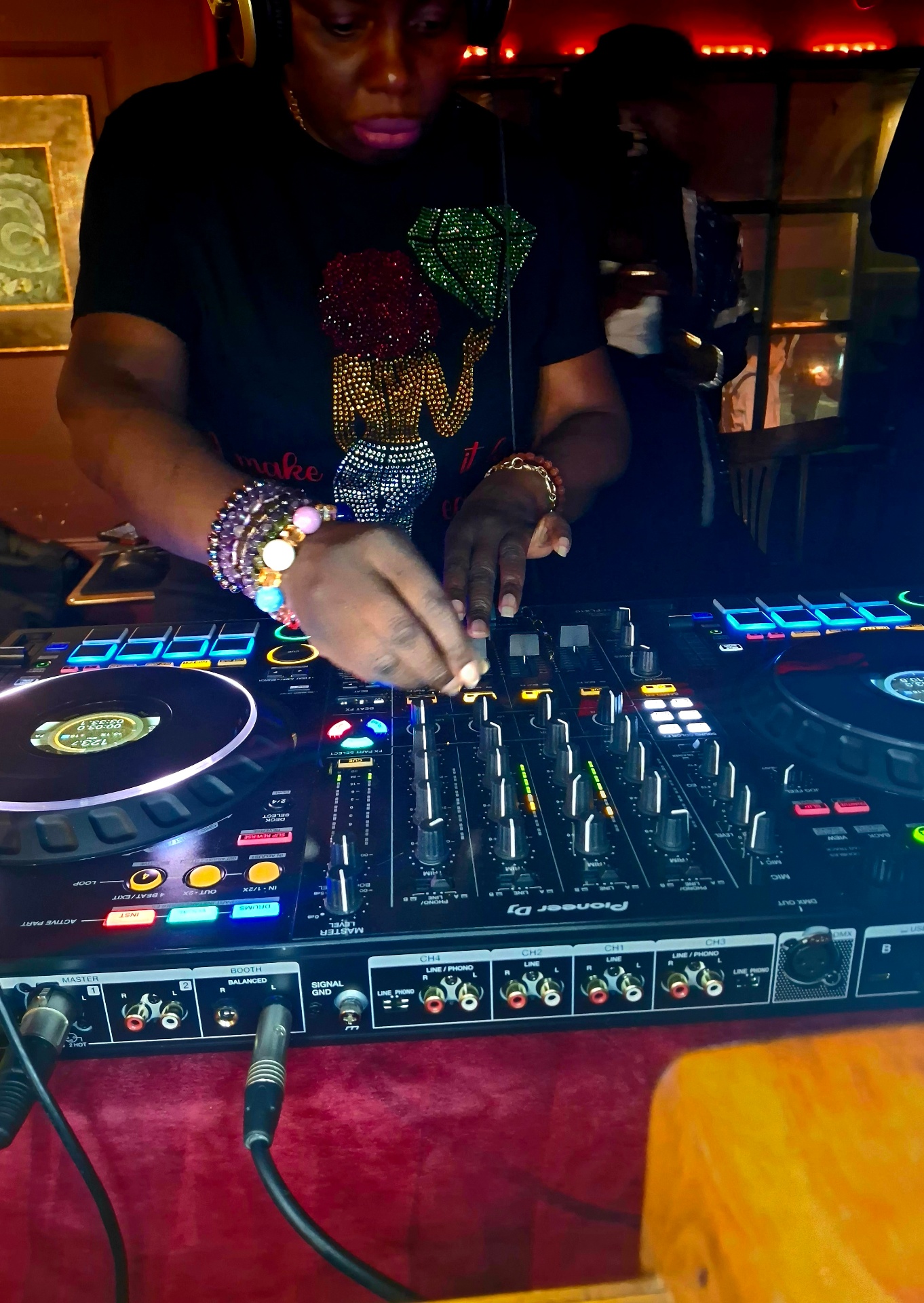 DJ OTB performing behind the decks